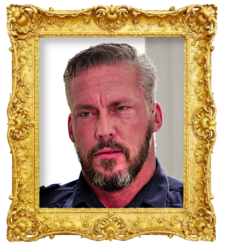 Headshot photo of Micke surrounded with an ornate golden frame.