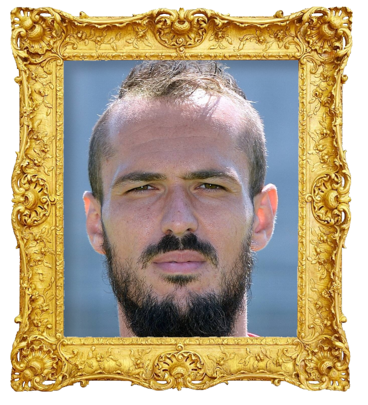 Headshot photo of Emir Kujović surrounded with an ornate golden frame.