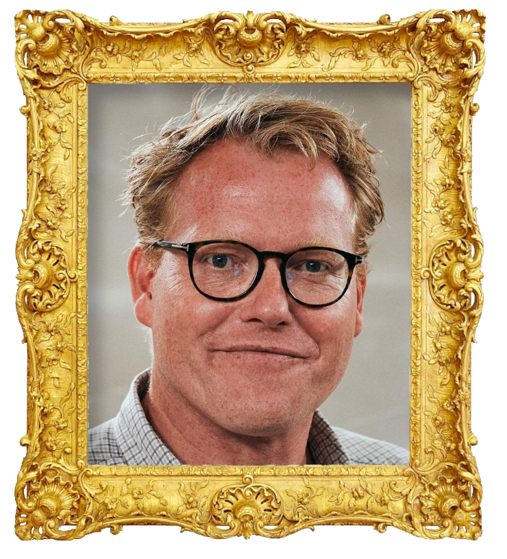 Headshot photo of Sebastian Klein surrounded with an ornate golden frame.