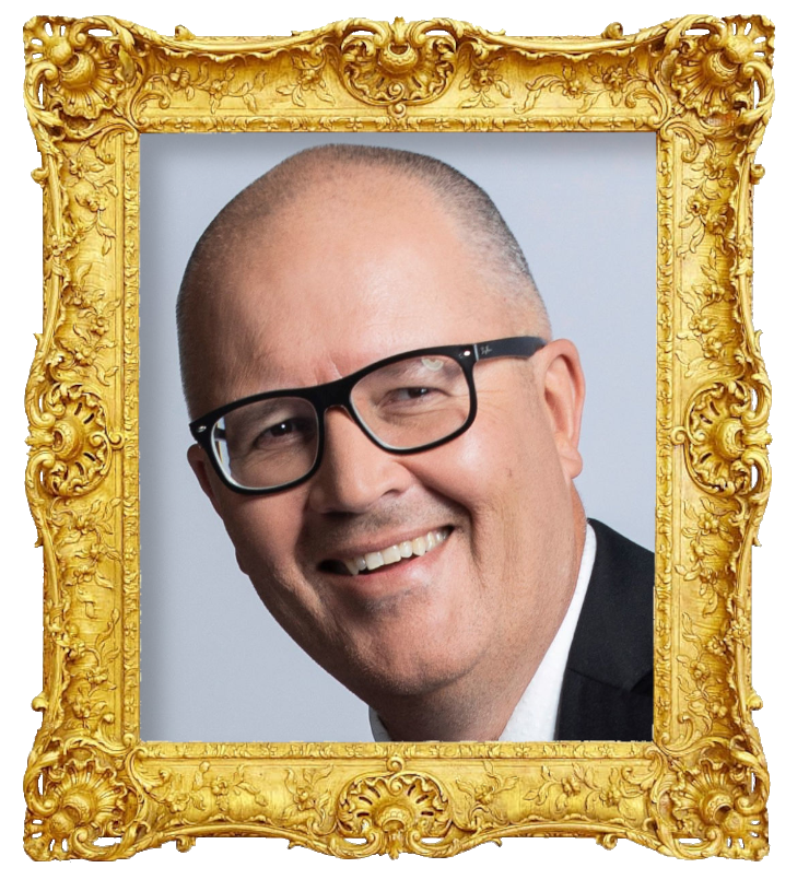 Headshot photo of Paul Ego surrounded with an ornate golden frame.