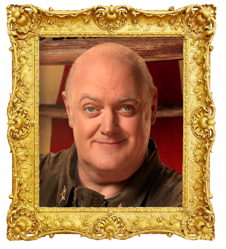 Headshot photo of Dara Ó Briain surrounded with an ornate golden frame.