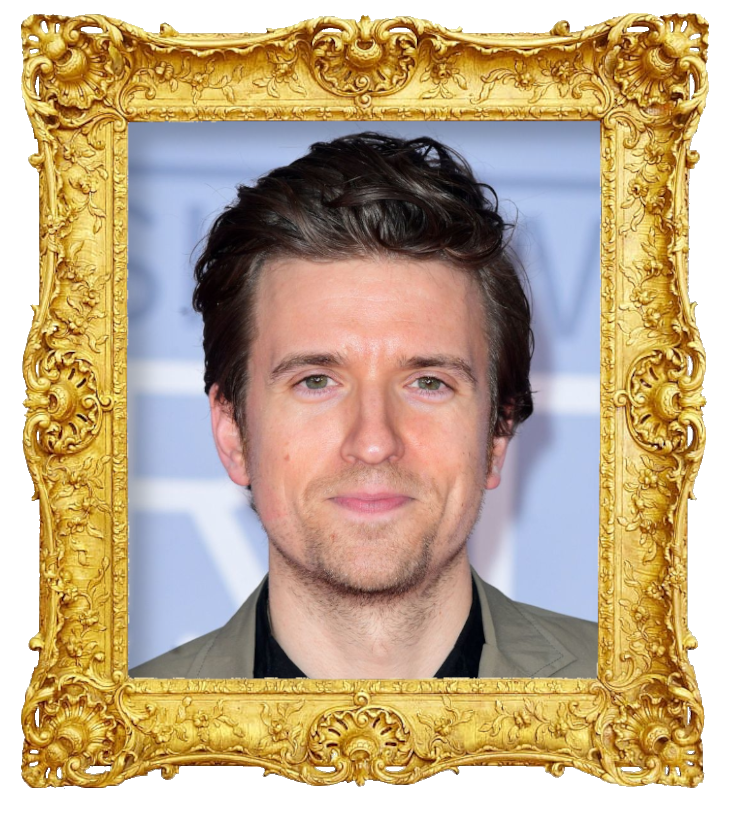 Headshot photo of Greg James surrounded with an ornate golden frame.