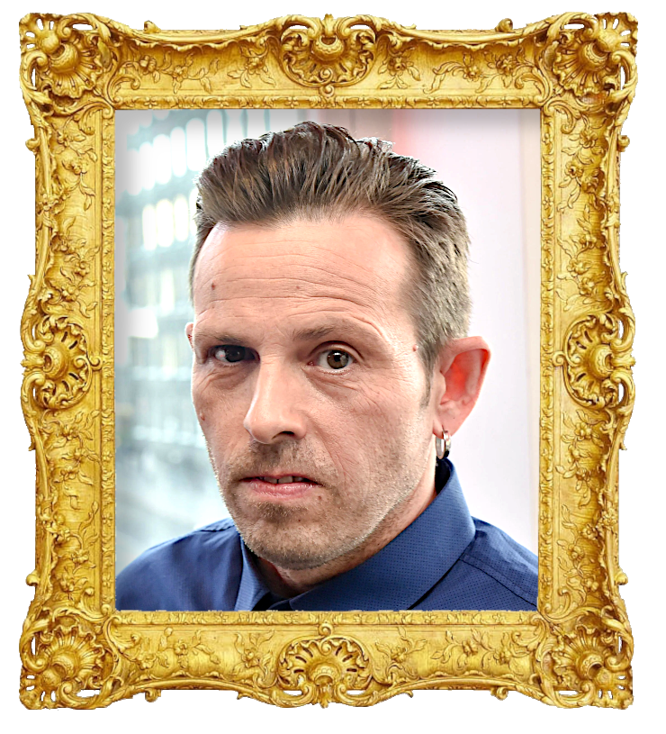 Headshot photo of Timo Lavikainen surrounded with an ornate golden frame.