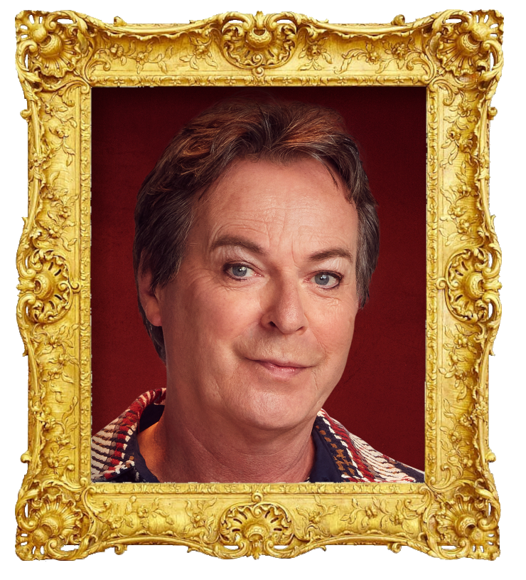 Headshot photo of Julian Clary surrounded with an ornate golden frame.