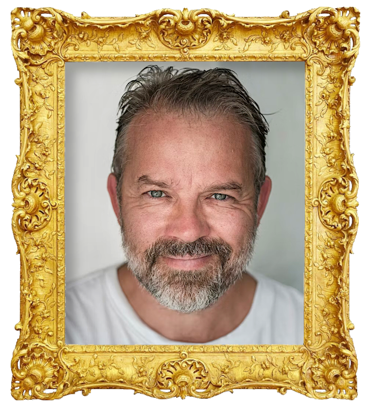 Headshot photo of Christian Skolmen surrounded with an ornate golden frame.