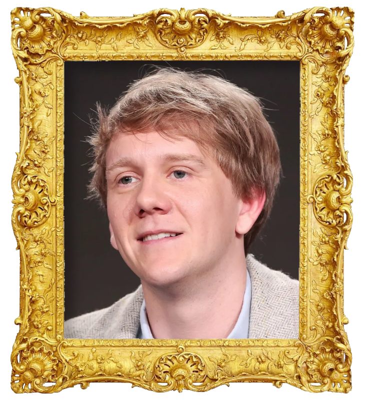Headshot photo of Josh Thomas surrounded with an ornate golden frame.