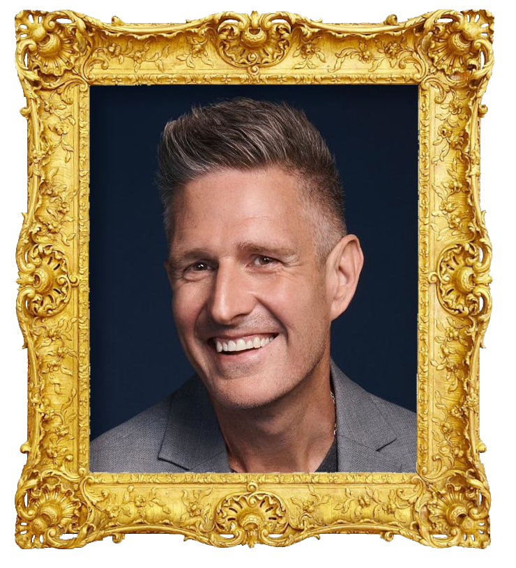 Headshot photo of Wil Anderson surrounded with an ornate golden frame.