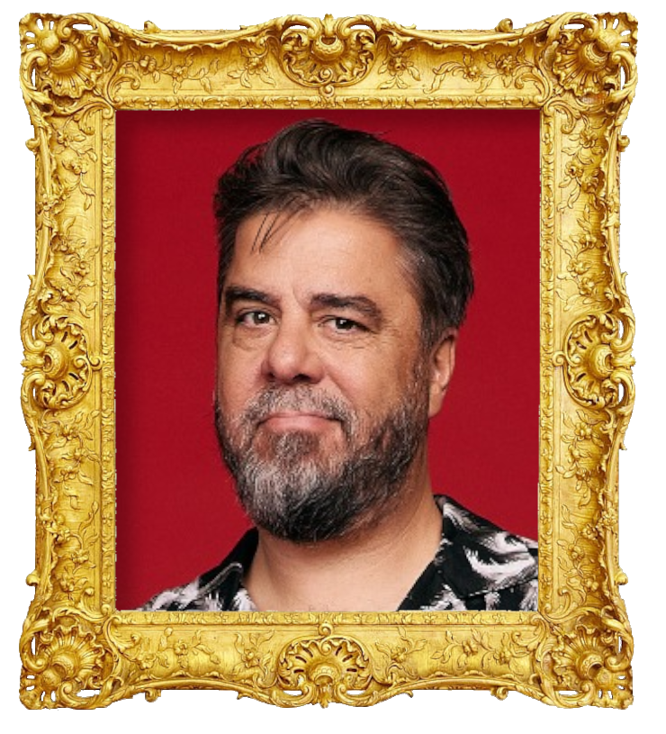 Headshot photo of Ben Hurley surrounded with an ornate golden frame.