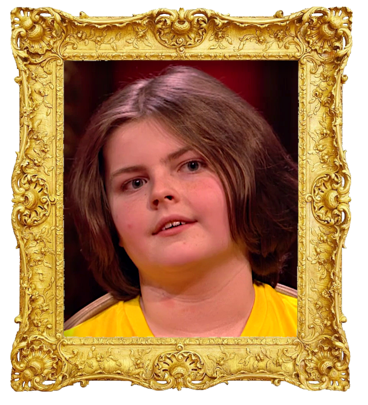 Headshot photo of Zac surrounded with an ornate golden frame.