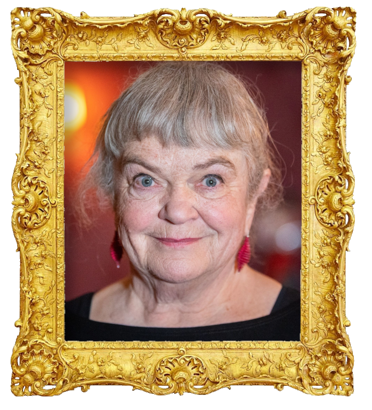 Headshot photo of Anne Marit Jacobsen surrounded with an ornate golden frame.