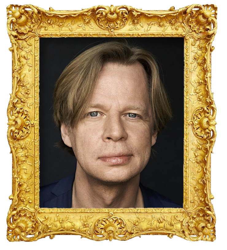 Headshot photo of Clement Kjersgaard surrounded with an ornate golden frame.