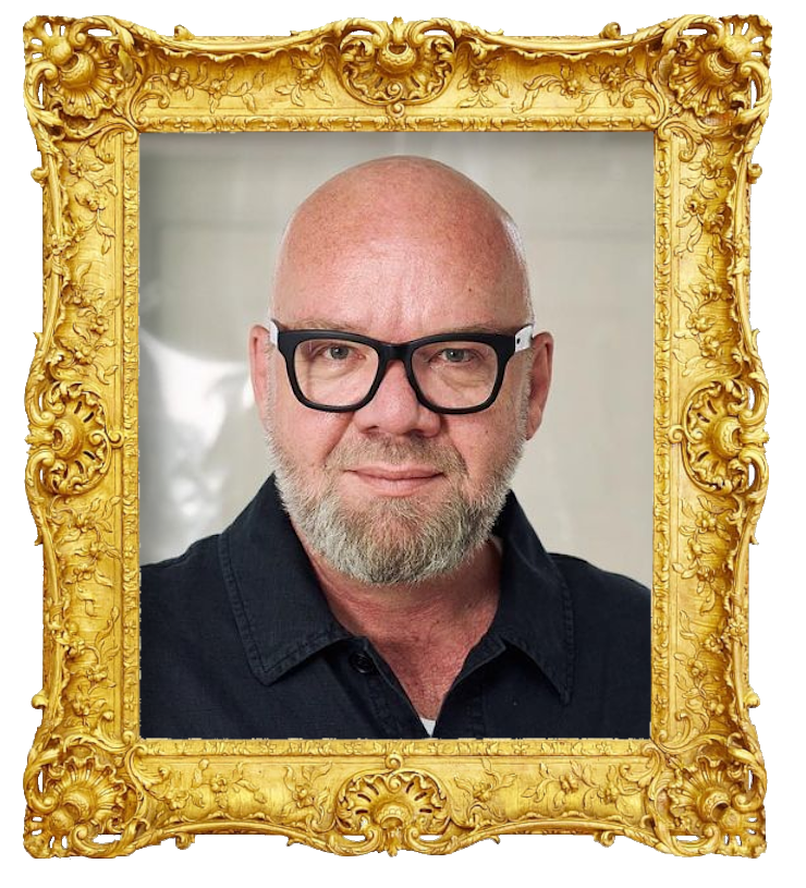 Headshot photo of Lars Hjortshøj surrounded with an ornate golden frame.