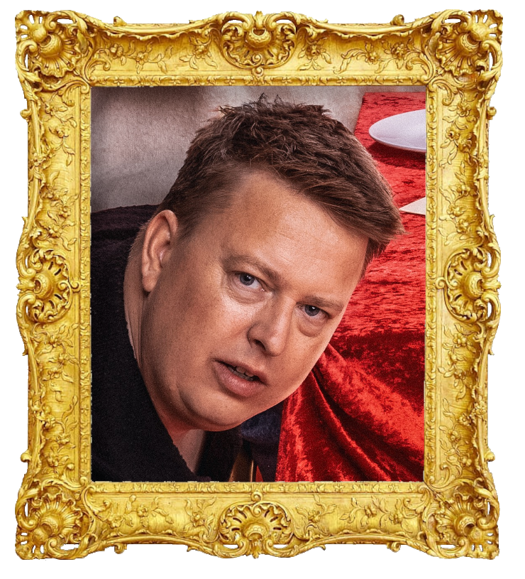 Headshot photo of Henrik Fladseth surrounded with an ornate golden frame.