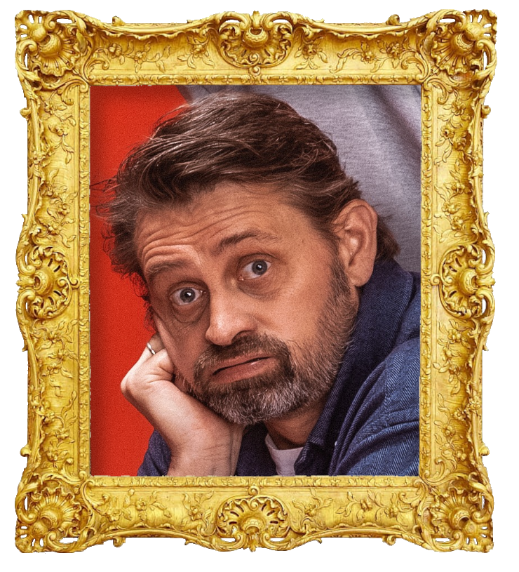 Headshot photo of Thomas Numme surrounded with an ornate golden frame.