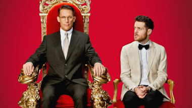 Cover image for the New Zealand show Taskmaster NZ, showing the hosts of the show, Jeremy Wells and Paul Williams.