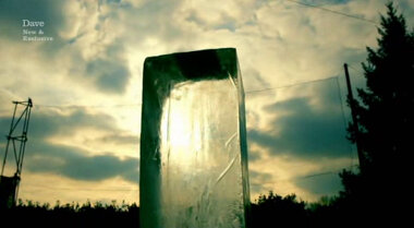 Image, taken from ground-level, of a large ice block, back-lit by the sun.