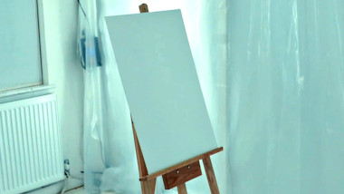 An empty canvas and an easel in the lab.