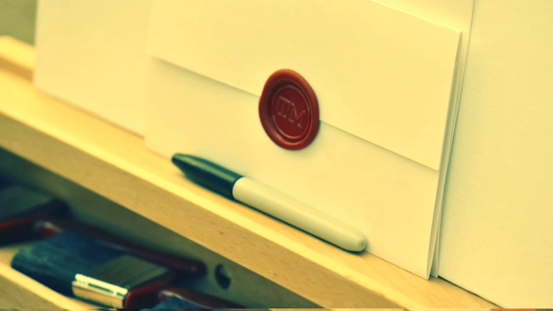 The task brief rests in front of a blank canvas on an easel, with a marker in front.