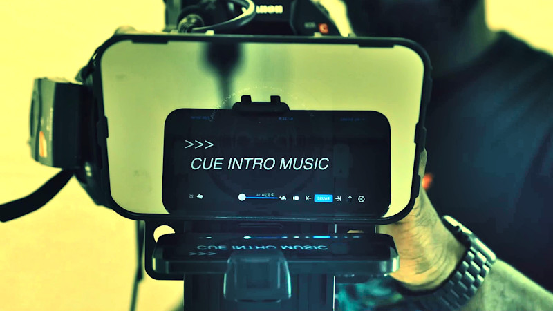 Autocue on a phone, seen reflecting on a mirror in front of a video camera.