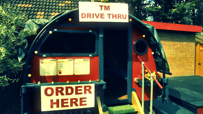 The hutch decorated as theTaskmaster drivethrough window, with appropriate signage and a menu board.